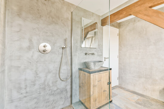 Bathroom with glass shower and washstand