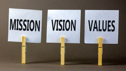 Mission vision values symbol. Concept words Mission Vision Values on white paper on clothespin on a...