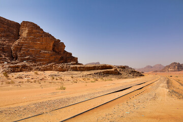 old obsolete rails covered by sand in wadi rum desert