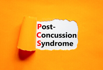 PCS post-concussion syndrome symbol. Concept words PCS post-concussion syndrome on white paper on a beautiful orange background. Medical and PCS post-concussion syndrome concept. Copy space.