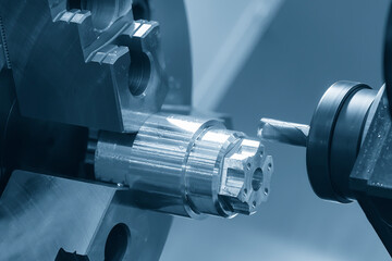 The multi-tasking CNC lathe machine  milling cut the metal shaft parts by milling turret.