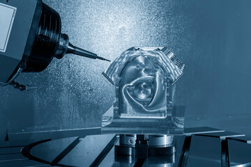 The 5-axis machining center cutting the V8 engine cylinder block with solid ball end mill tool.