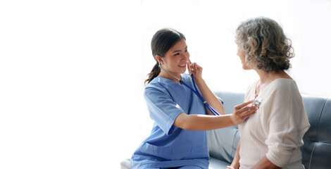 Asian female doctor examining a patient to assess the illness for proper treatment.