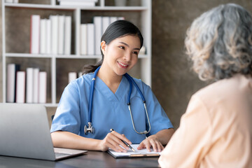 Asian female doctor examining a patient to assess the illness for proper treatment.