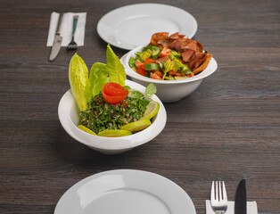 Fattouch and tabouleh Lebanese salad isolated on white, traditional lebanese salad of tabbouleh and fattouch