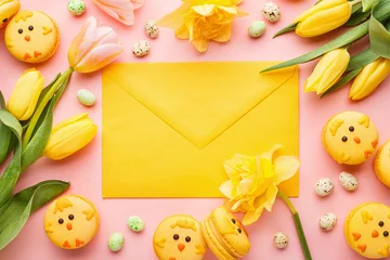 Fototapete Rund Easter background made of macaroon chicks, yellow tulips and daffodils, candy chocolate eggs and yellow envelope over pink background. Top view, copy space.  Holiday symbol © Zygonema