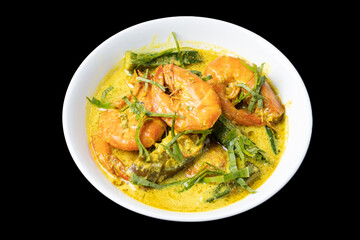 Udang Masak Lemak or Prawn coconut curry on white bowl, soft focus