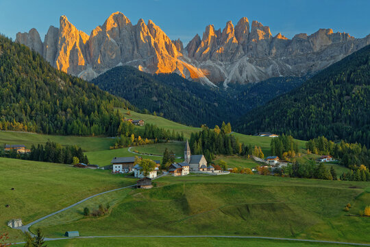 Landscape of Santa Maddalena Alta, Val di Funes, at sunset, on the italian Dolomites, with fall colors