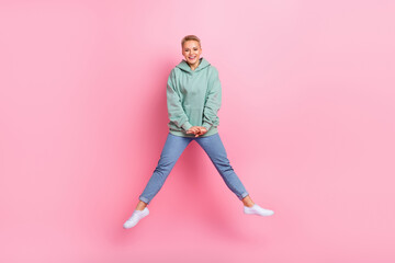 Fototapeta na wymiar Full length photo of cheerful lovely lady wear trendy clothes celebrate victory win lottery isolated on pink color background
