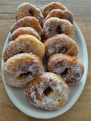 Closeup of Italian donuts or doughnuts called Graffe, typical from Naples in carnival in winter. Italian pastry from Napoli called graffe or graffette, traditional food during carnevale in February