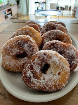 Closeup of Italian donuts or doughnuts called Graffe, typical from Naples in carnival in winter. Italian pastry from Napoli called graffe or graffette, traditional food during carnevale in February