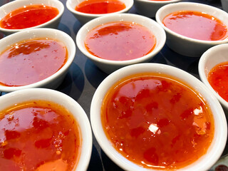 Dishes of sweet chilli sauce