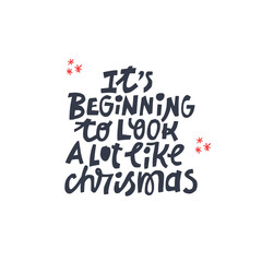 Winter hand drawn quote isolated on background - it's beginning to look a lot like christmas.
