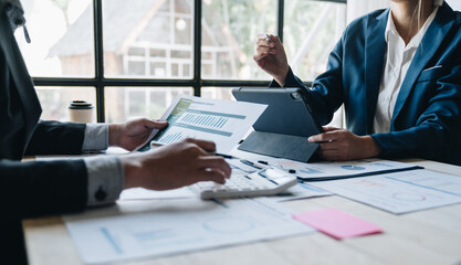 Asian business people brainstorming in a graph analytical computing plan meeting. data chart Marketing growth. Finance. The concept of business success statistics.