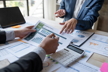 Asian business people brainstorming in a graph analytical computing plan meeting. data chart Marketing growth. Finance. The concept of business success statistics.