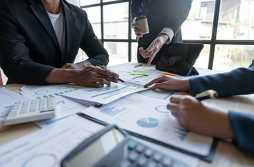 Asian business people brainstorming in a graph analytical computing plan meeting. data chart Marketing growth. Finance. The concept of business success statistics.