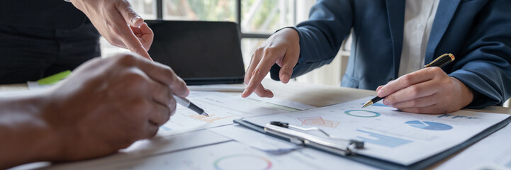 Asian business people brainstorming in a graph analytical computing plan meeting. data chart Marketing growth. Finance. The concept of business success statistics.