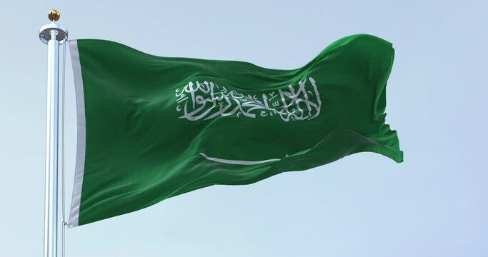 Saudi Arabia national flag waving in the wind on a clear day