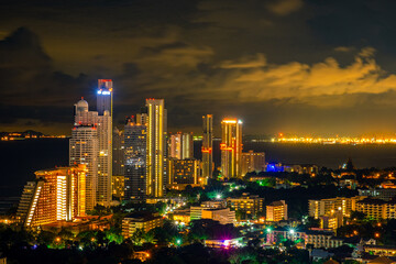 Fototapeta na wymiar Aerial view of Pattaya city at night. Cityscape of Pattaya city at night. Image contain of noise and dust. Select focus.