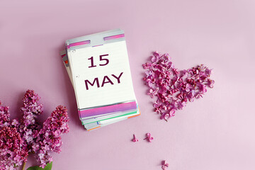  Calendar for May 15: a desk calendar with the numbers 15, the name of the month of May in English,...