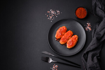Meat cutlet or meatballs in tomato sauce with garlic, salt, spices and herbs