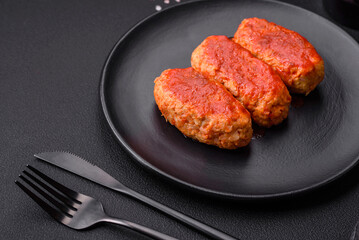 Meat cutlet or meatballs in tomato sauce with garlic, salt, spices and herbs