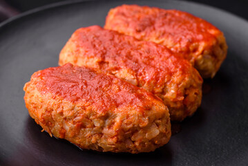 Meat cutlet or meatballs in tomato sauce with garlic, salt, spices and herbs