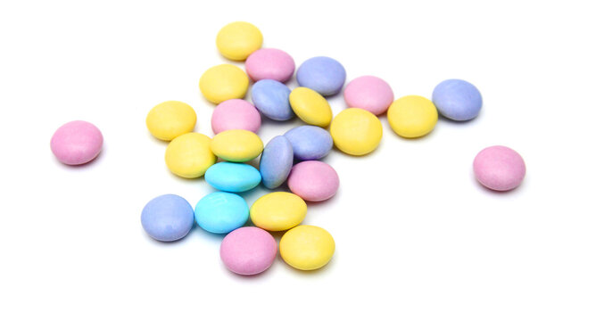 Closeup of colorful chocolate candies on white 