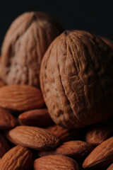 close up almonds and nuts detail image with black background