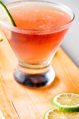 Cosmopolitan cocktail. Cosmo cocktail, is a cocktail made with vodka, Cointreau, cranberry juice, and freshly squeezed or sweetened lime juice. Classic drink made famous on popular TV shows. 