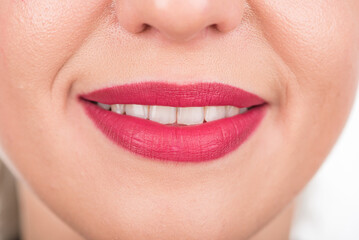 Fototapeta premium Curious Woman Face With Pretty Smile and White Teeth. Studio Photo Shoot. Use Bright Red Lipstick.