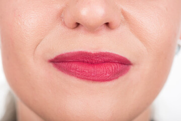 Fototapeta premium Sad And Curious Woman Face. Studio Photo Shoot. Use Bright Red Lipstick.