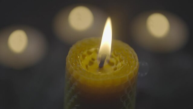 Close-up of burning candles. Romantic atmosphere at dinner. Candle light. High quality 4k footage