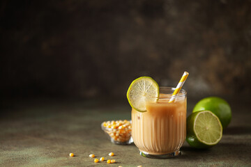 Tejuino traditional mexican drink with corn and lime. Copy space - obrazy, fototapety, plakaty
