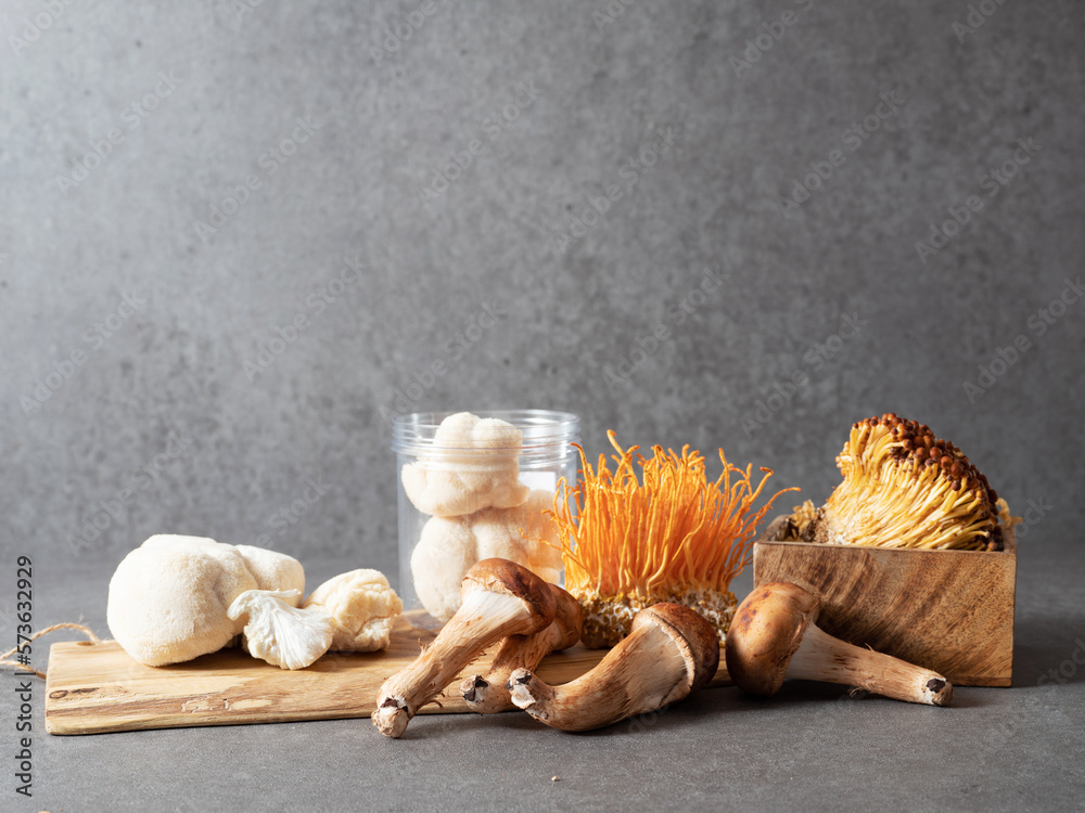 Canvas Prints Various types of mushrooms on a wooden plate