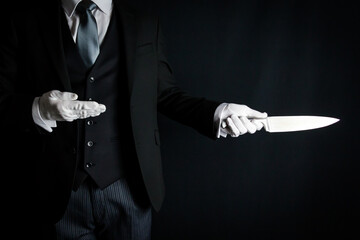 Portrait of Butler in Dark Suit and White Gloves Holding Sharp Knife. Concept of Butler Did It.