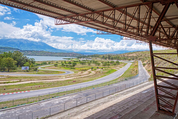 Abandoned Yahuarcocha race car circuit, with the Yahuarcocha lake in the background, on a beautiful sunny morning. Yahuarcocha, Imbabura province, Ecuador.