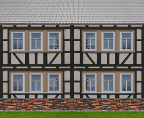  Historische Hausfassade mit Rasenfläche und Bruchsteinmauer