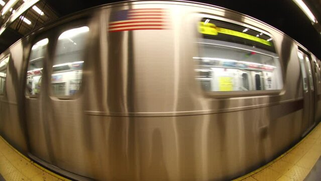 new york subway train coming into the station