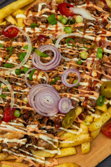 pizza on dough of fried potatoes