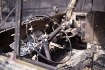Fototapeta premium Steering wheel of a burnt car