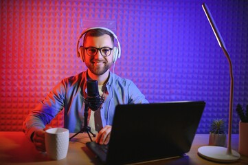 streamer is streaming online content,metaverse ar vr,gaming and esports concept.Happy man gamer...