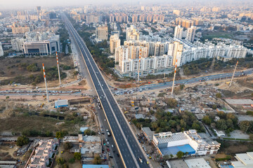 aerial drone still shot showing busy sohna elevated highway toll road with traffic stuck at...