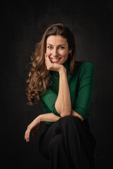 Fototapeta premium Beautiful brunette haired woman studio portrait against at isolated background