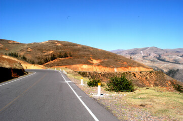 ayacucho peru mountain with curve on the road with asphalt in blue sky may 2020