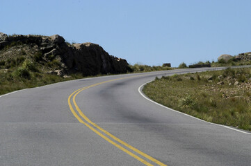 asphalt road with curves aerial view without transportation on a mountain in the province of san...