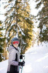 Fototapeta na wymiar Young woman enjoing Winter Day of Skiing Fun in the Snow