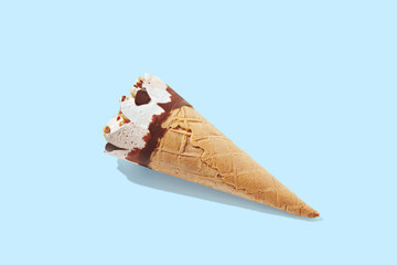 vanilla ice cream with cone on blue pastel background