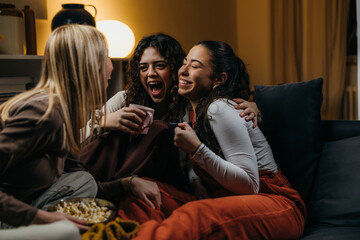 Three close friends have a fun evening at home