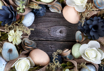 Fototapeta na wymiar Circle border of a wreath decorated for Easter holiday concept on rustic wood